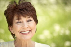 Older woman smiling outside dry mouth general dentistry dentist in Ardmore Pennsylvania
